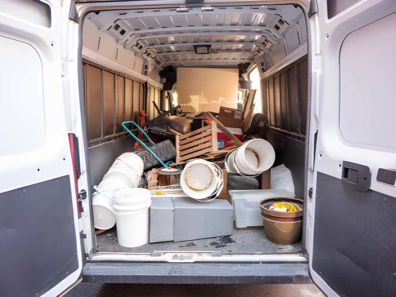 Van filled with assorted junk items
