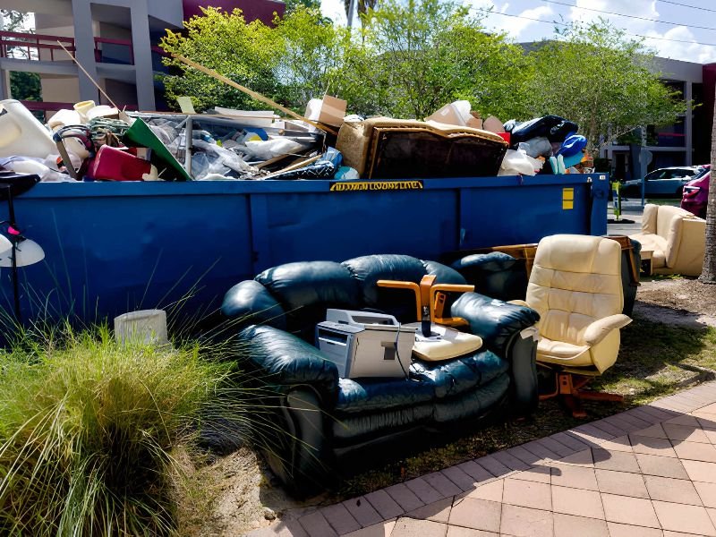 Dumpster full of garbages at residential garbage dump